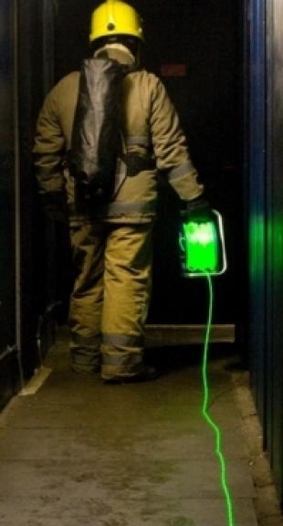 Firefighter with fibreoptic cable